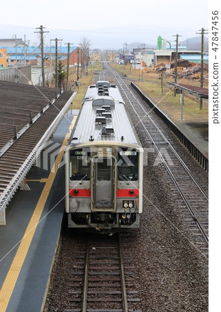 A two-car train that stops at Togan Station A two-car train that stops at Togan Station 47847456