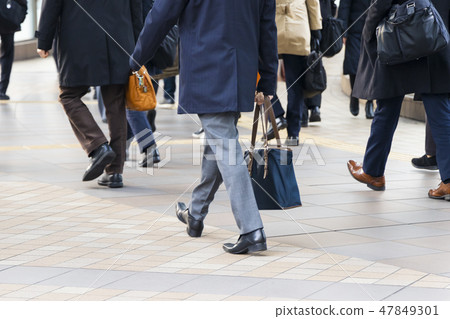 Commuter landscape behind the winter businessman 47849301