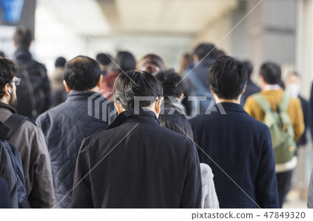Commuter landscape behind the winter businessman Commuter landscape behind the winter businessman 47849320