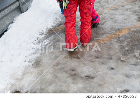 The feet of a woman walking on a slope of a slope The feet of a woman walking on a slope of a slope 47850558