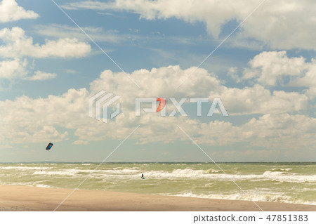 people are engaged in kitesurfing people are engaged in kitesurfing 47851383