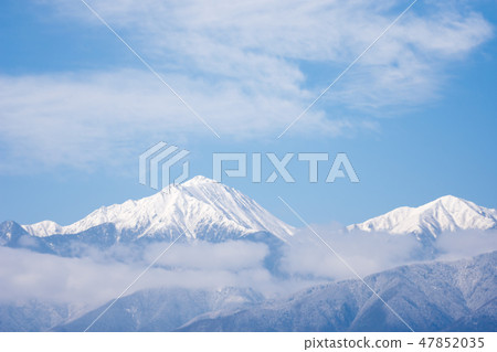 A snowy strange mountain and cloud 47852035