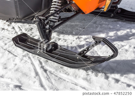 Snowmobile ride on snowy mountains and woods 47852250