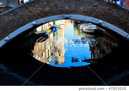 Venice city reflection under the street bridge. Italy 47853028
