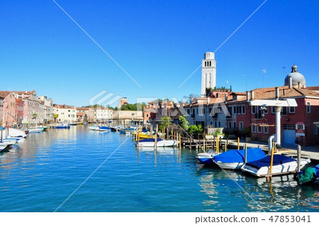 Non touristic part of Venice with empty silence colorful buildings, windows, streets and boats 47853041