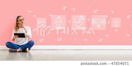 LiFi theme with woman using a tablet 47854071