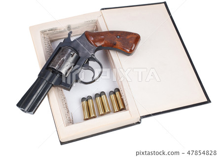 A gun hidden inside a book A gun hidden inside a book 47854828