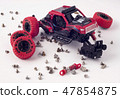 Disassembled car and scattered parts. Broken toy 47854875