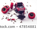 Disassembled car and scattered parts. Broken toy 47854881