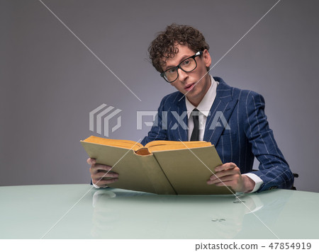 Man reading book 47854919