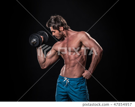 Man with bare chest lifting dumbbell Man with bare chest lifting dumbbell 47854957