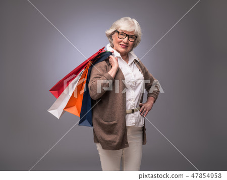 Senior woman with shopping bags Senior woman with shopping bags 47854958