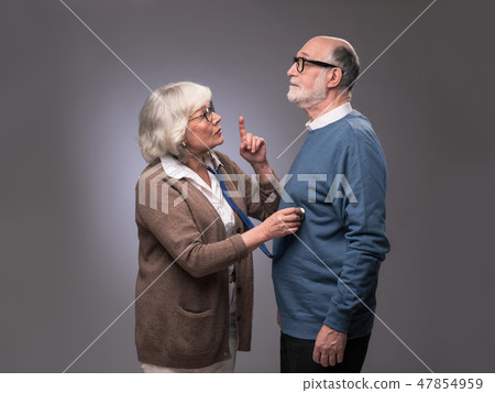 Senior woman checking heart beat Senior woman checking heart beat 47854959