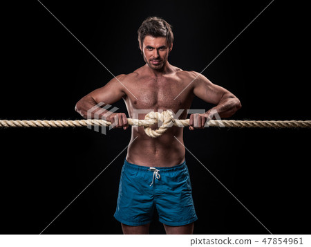 Muscular man with heavy ropes Muscular man with heavy ropes 47854961