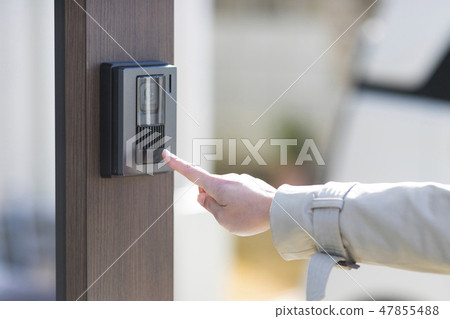 Women's hand pressing intercom 47855488