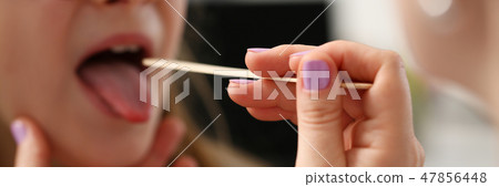 A small little child on a doctor's examination A small little child on a doctor's examination 47856448