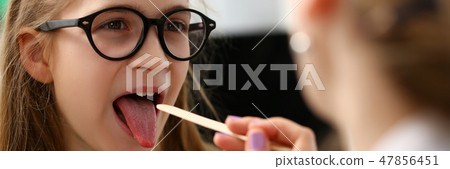 A small little child on a doctor's examination A small little child on a doctor's examination 47856451