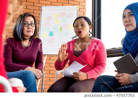 Group of diverse women discussing in the meeting 47857763