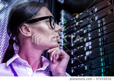 Portrait of a smart young woman thinking about information systems Portrait of a smart young woman thinking about information systems 47858856