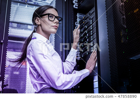 Serious smart woman working as a hacker 47858890