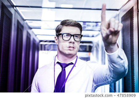 Intelligent young man looking at the screen 47858909