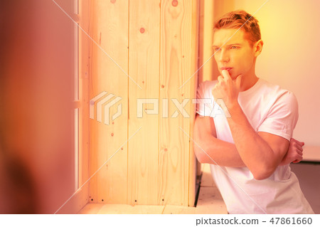 Concentrated focused guy making first responsible decision 47861660