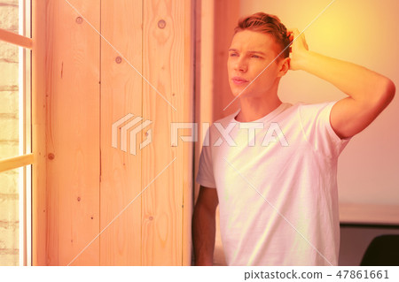 Reflective musing guy facing his inner conflict 47861661