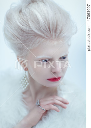 beautiful albino young woman with red lips 47863007