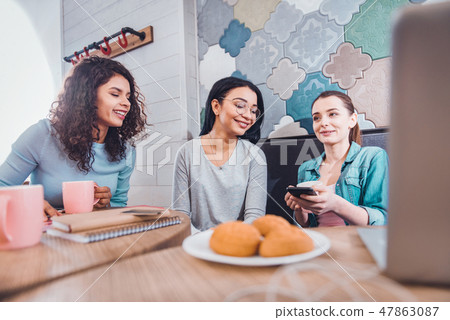 Pleasant positive women meeting in the cafe Pleasant positive women meeting in the cafe 47863087