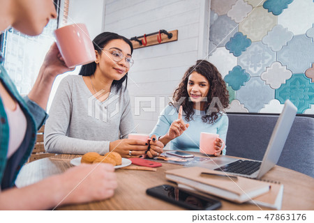 Joyful creative women organizing together a startup Joyful creative women organizing together a startup 47863176