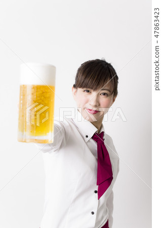 A woman with a beer mug A woman with a beer mug 47863423