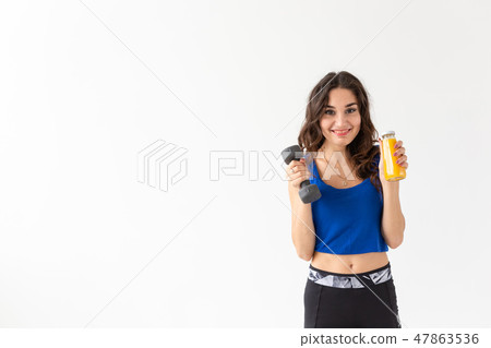 Healthy lifestyle, people and sport concept - Woman with healthy juice drinking for sport and 47863536
