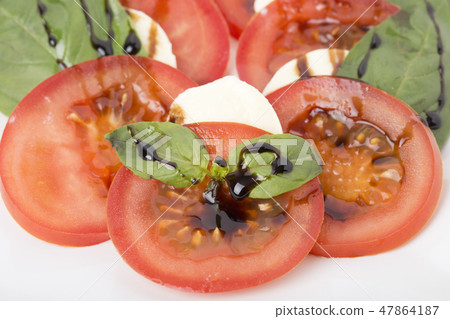 Fragment of salad with tomato and mozzarella. Fragment of salad with tomato and mozzarella. 47864187
