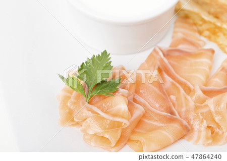 Fragment of breakfast with salmon and pancake. 47864240