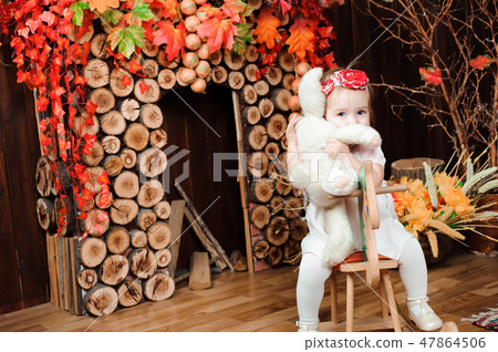 beautiful little girl with toy smiling at the camera beautiful little girl with toy smiling at the camera 47864506