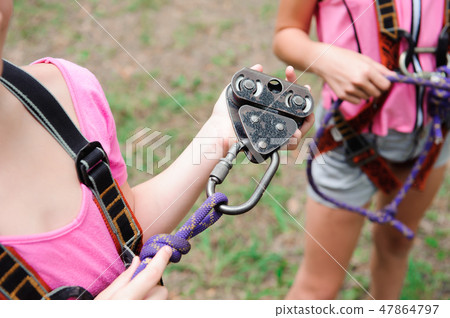 adventure climbing high wire park - hiking in rope park two girls adventure climbing high wire park - hiking in rope park two girls 47864797