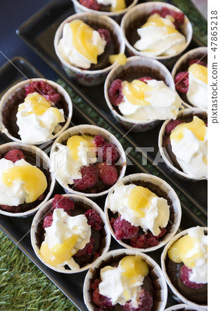 Delicious raspberries and chocolate Cupcake 47865218