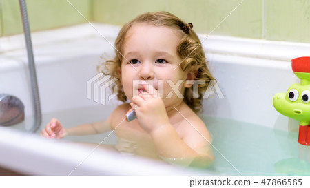 Panoramic view of a wash of a cute playful baby Panoramic view of a wash of a cute playful baby 47866585