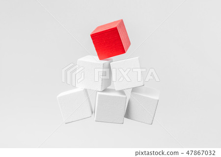 Abstract floating wooden pyramid on white 47867032