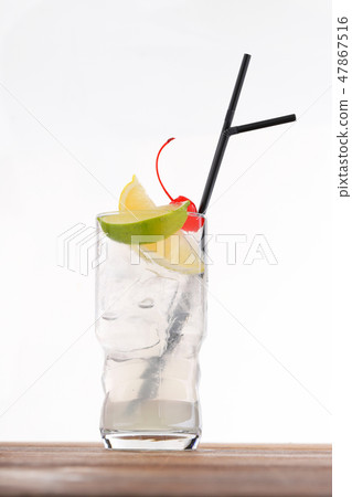 Cold alcohol cocktail with ice cubes 47867516