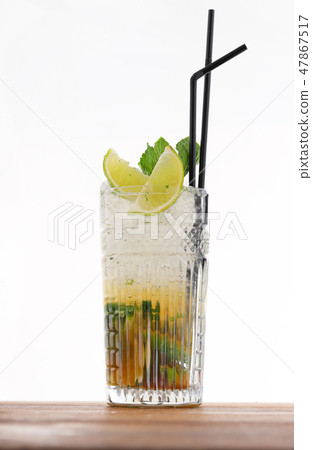 Cold alcohol cocktail with mind and ice cubes Cold alcohol cocktail with mind and ice cubes 47867517