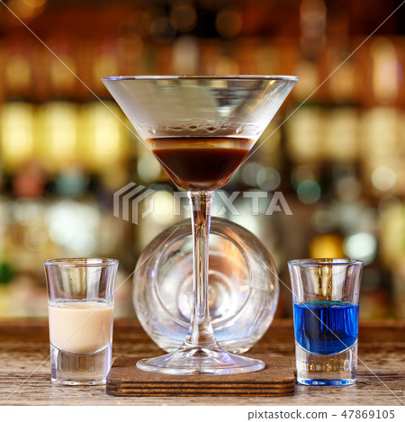 Burning cocktail on the bar 47869105