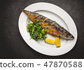 Grilled mackerel fillets with lemon on black board 47870588
