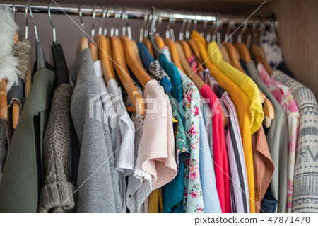 Wardrobe closet full of colorfull clothes Wardrobe closet full of colorfull clothes 47871470