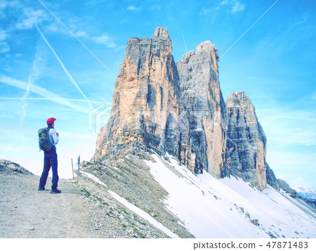Travel Man enjoying serene view Tre Cime mountains Travel Man enjoying serene view Tre Cime mountains 47871483