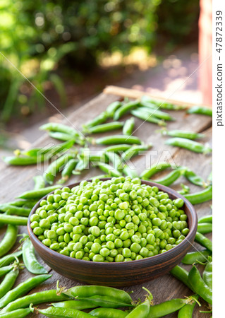 raw peas on the table raw peas on the table 47872339