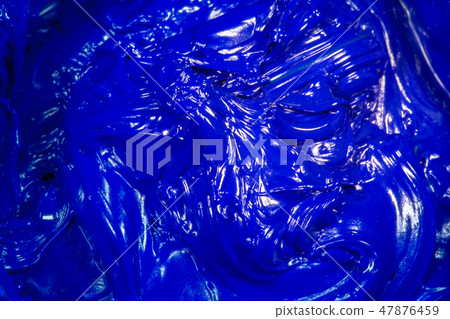 close up dark blue color of oil paint 47876459