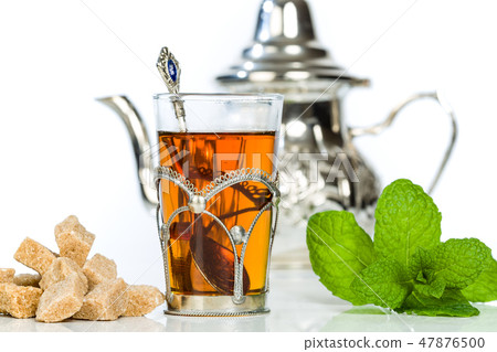 Traditional arabic mint tea in the typical glass Traditional arabic mint tea in the typical glass 47876500