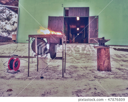 Blacksmith portable forge heating horse shoes 47876809