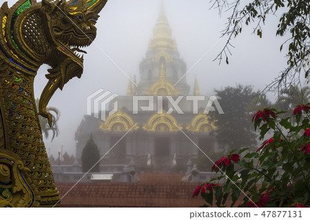 Sinakarintra Stit Mahasantikhiri Pagoda in a beautiful foggy morning 47877131